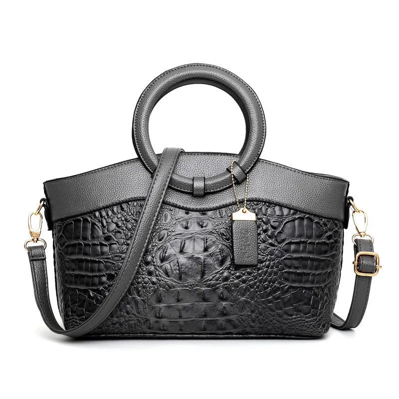 Ladies casual fabric handbag in multiple colours with zipper compartments, shown with shoulder strap.