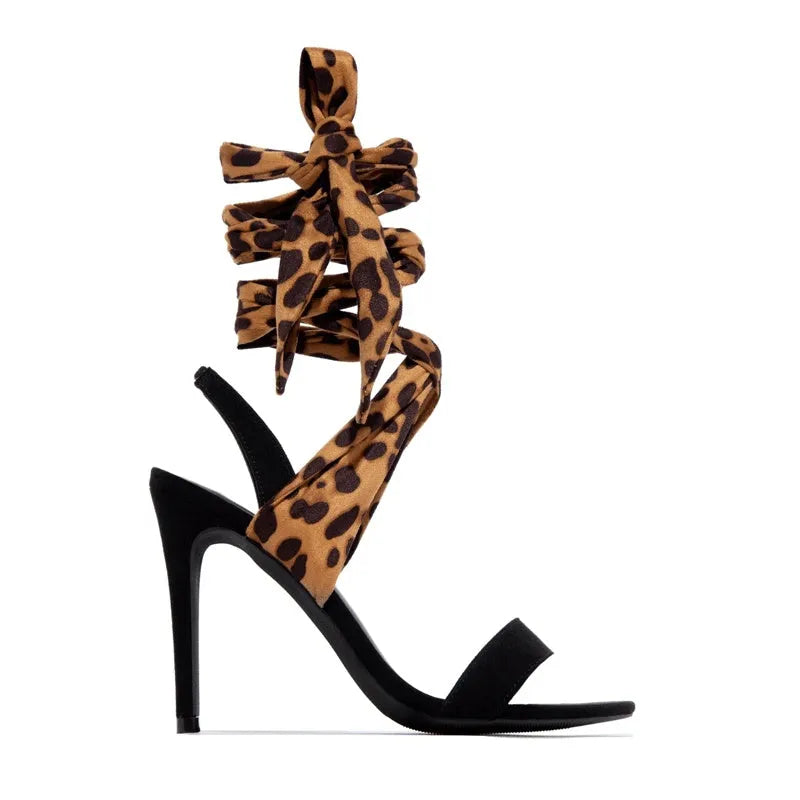 Light brown leopard print high heel shoes with cross straps and super high heel