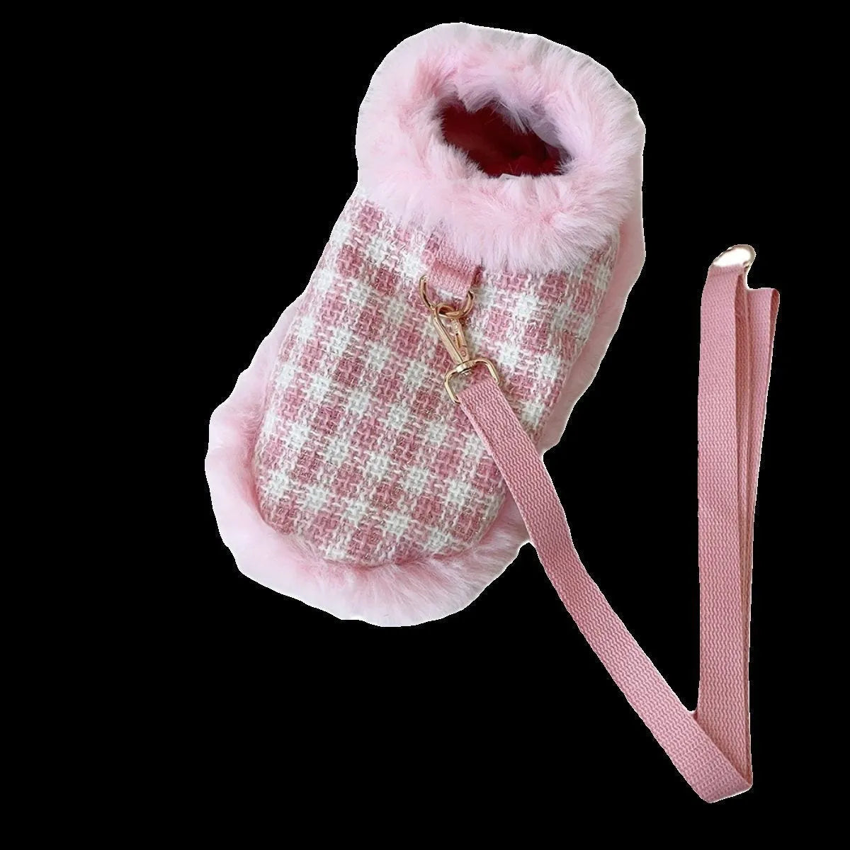Pink cat wearing a beret and a cloak with a hand holding rope attached.