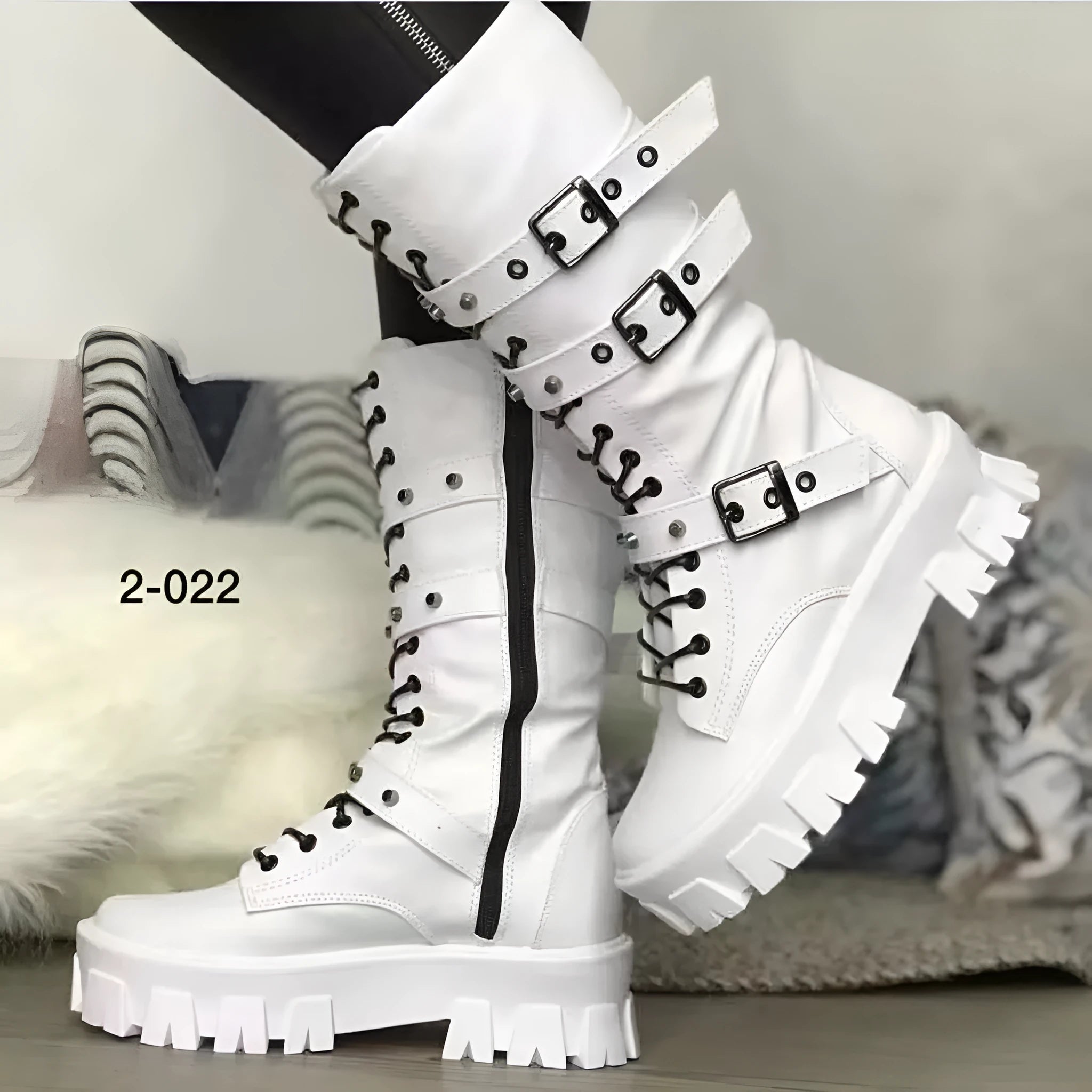 Women's black mid-calf knight boots with a metal buckle strap and side zipper.