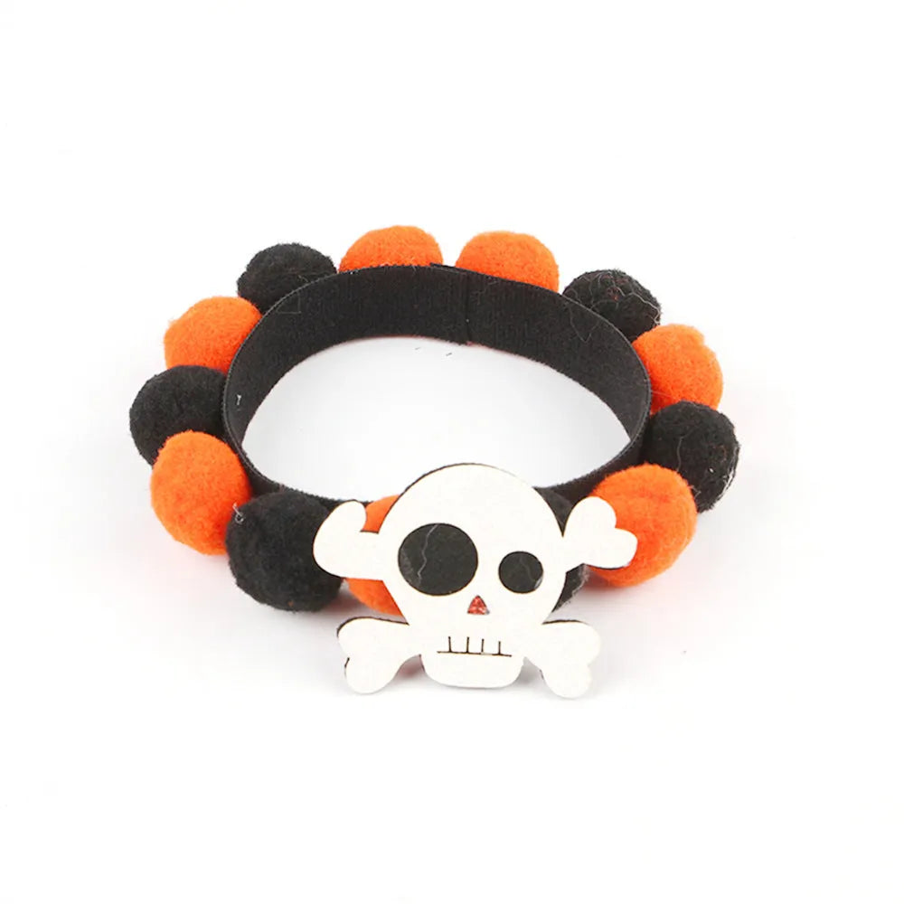 Halloween pet collar with soft fur ball pumpkin accessory in orange, sized on a dog's neck.