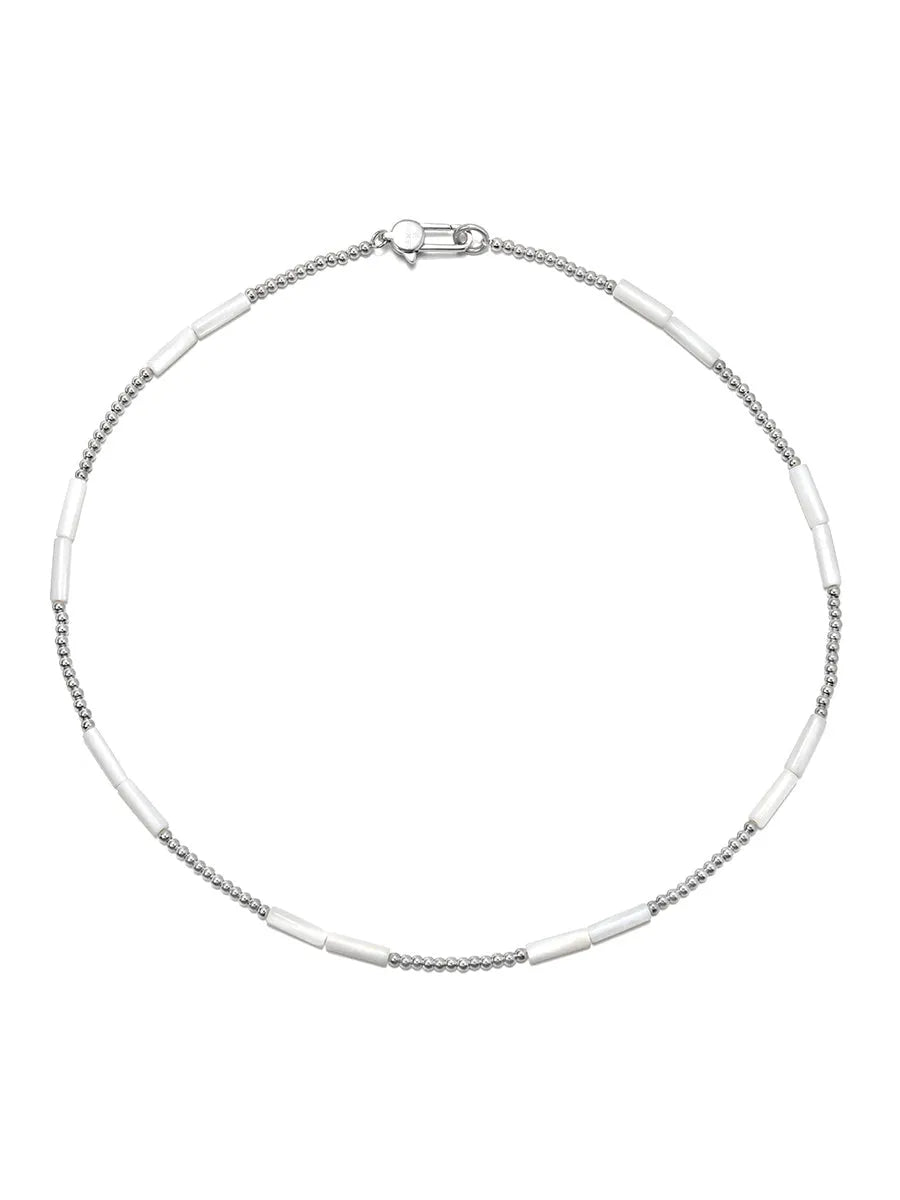 White shell and silver steel bead handmade collarbone chain necklace on display