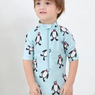 Boy's penguin print swim set with long sleeves and matching swimming cap for ages 2-7 years