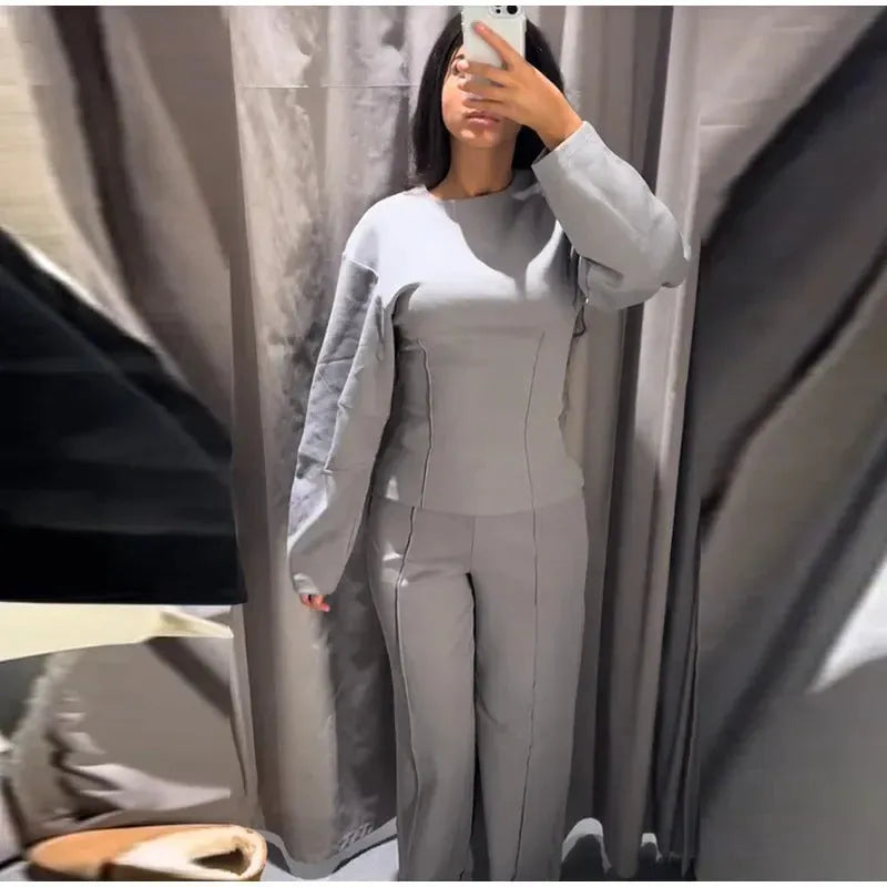 Women's black polar fleece suit with long sleeve O-neck top and wide leg trousers