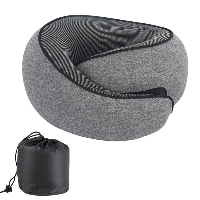 A U-shaped memory foam travel neck pillow in a simple design, shown with its matching storage bag.