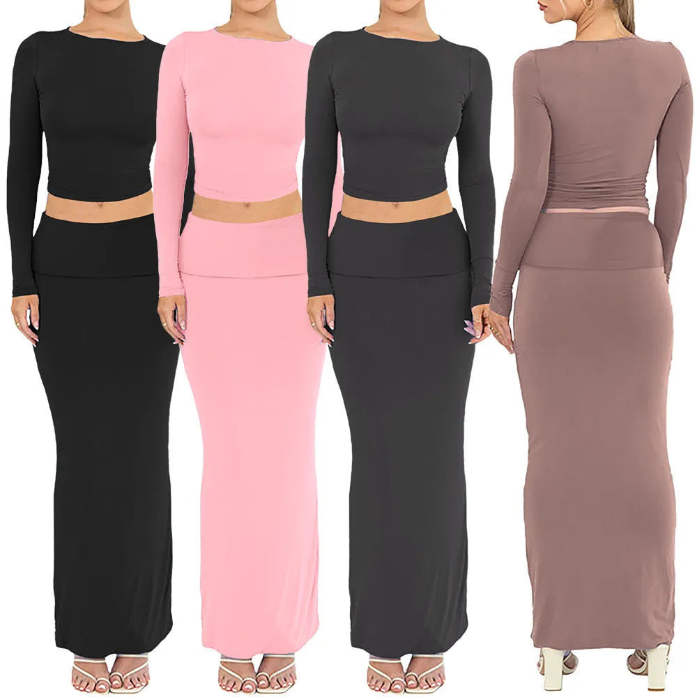 Women's black polyester two-piece suit with waist-exposing top and long skirt