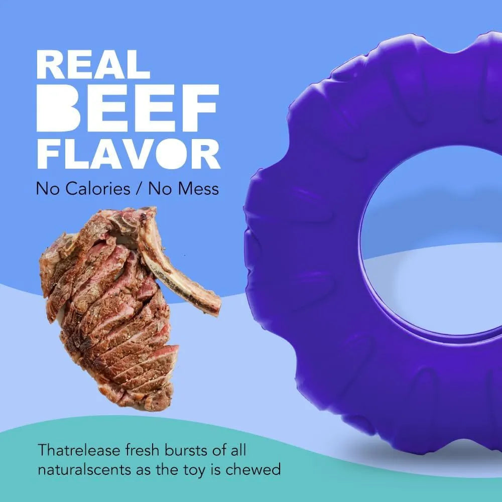 Blue, green, and red tyre-shaped dog chew toy with oval openings, a slow feeder and treat dispenser.