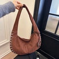 Soft plush retro style tote handbag for women in a choice of colours, shown as a strapless design.
