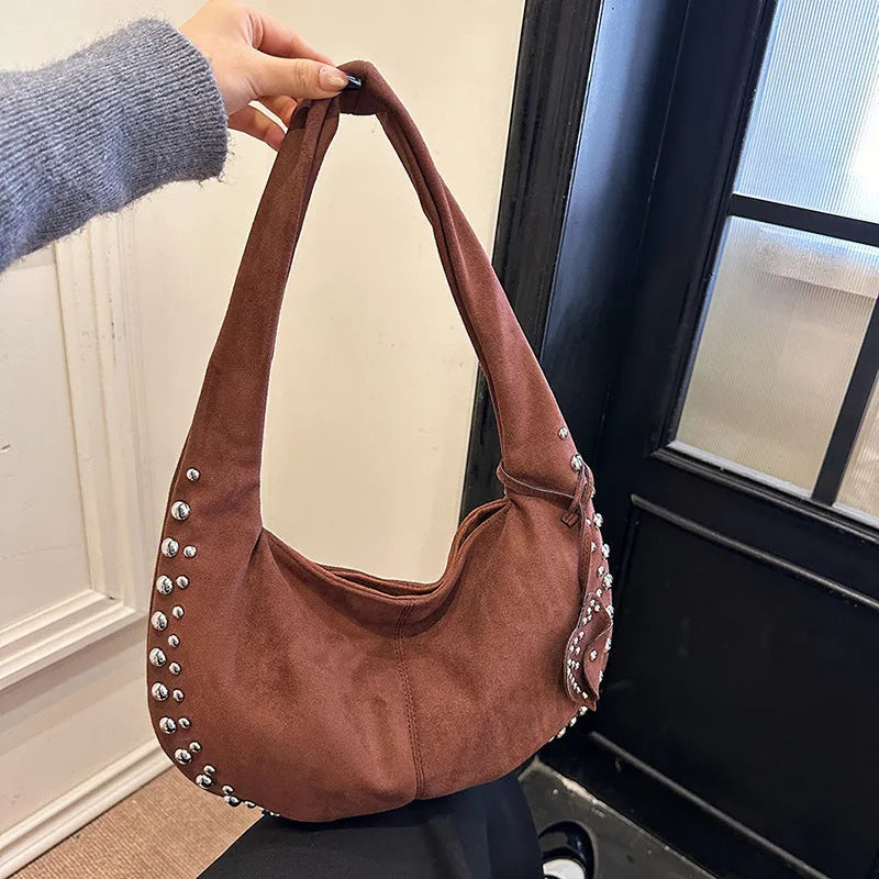 Soft plush retro style tote handbag for women in a choice of colours, shown as a strapless design.