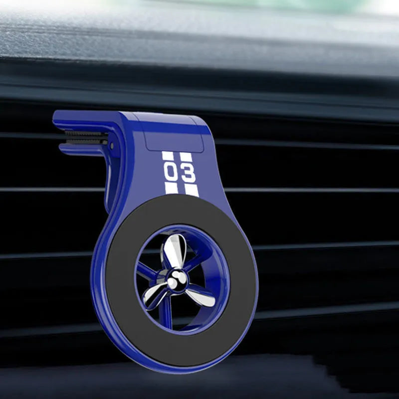 Black universal magnetic car phone holder clipped to a car air vent, holding a smartphone.
