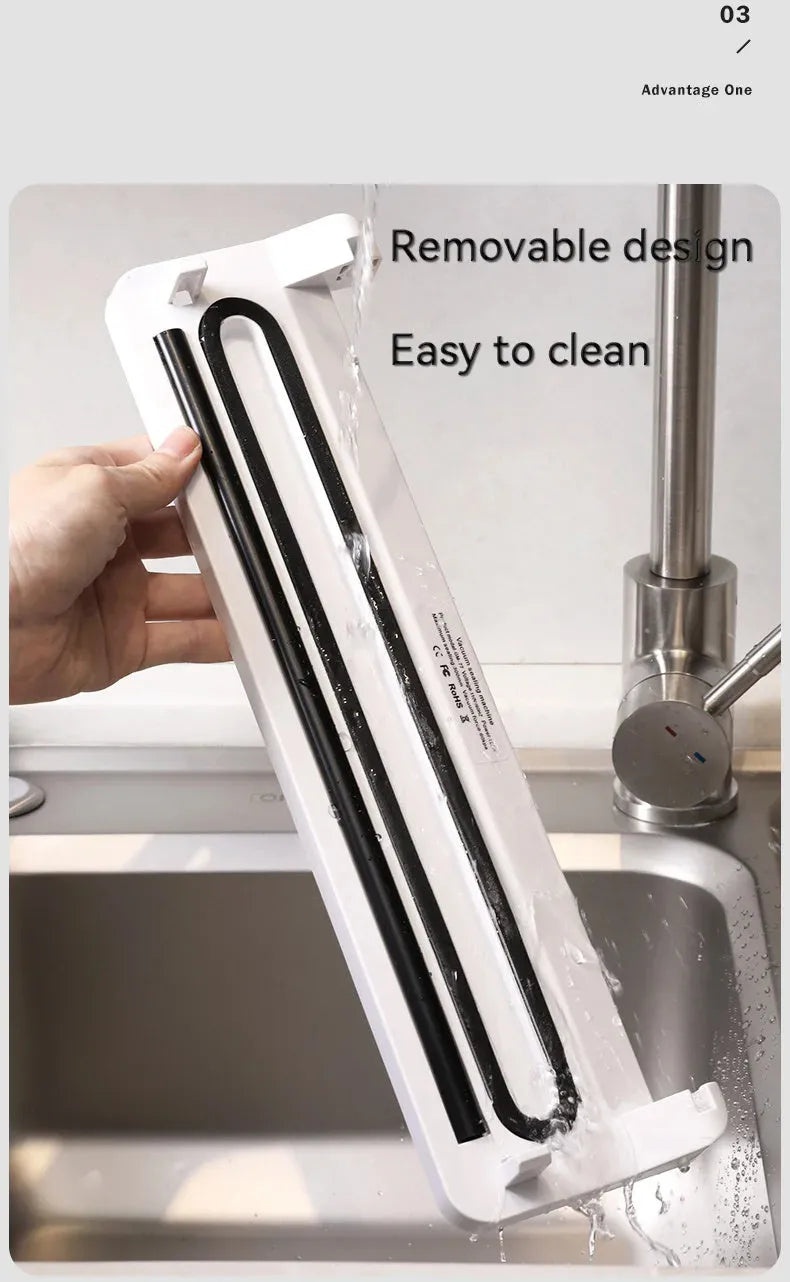 Small black automatic vacuum sealer machine for food preservation and item protection