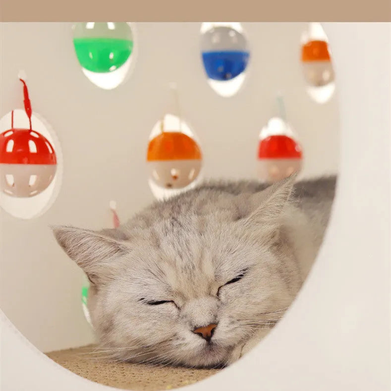 House-shaped cat scratch board with integrated bell ball and plastic tunnel forming multifunctional cat furniture