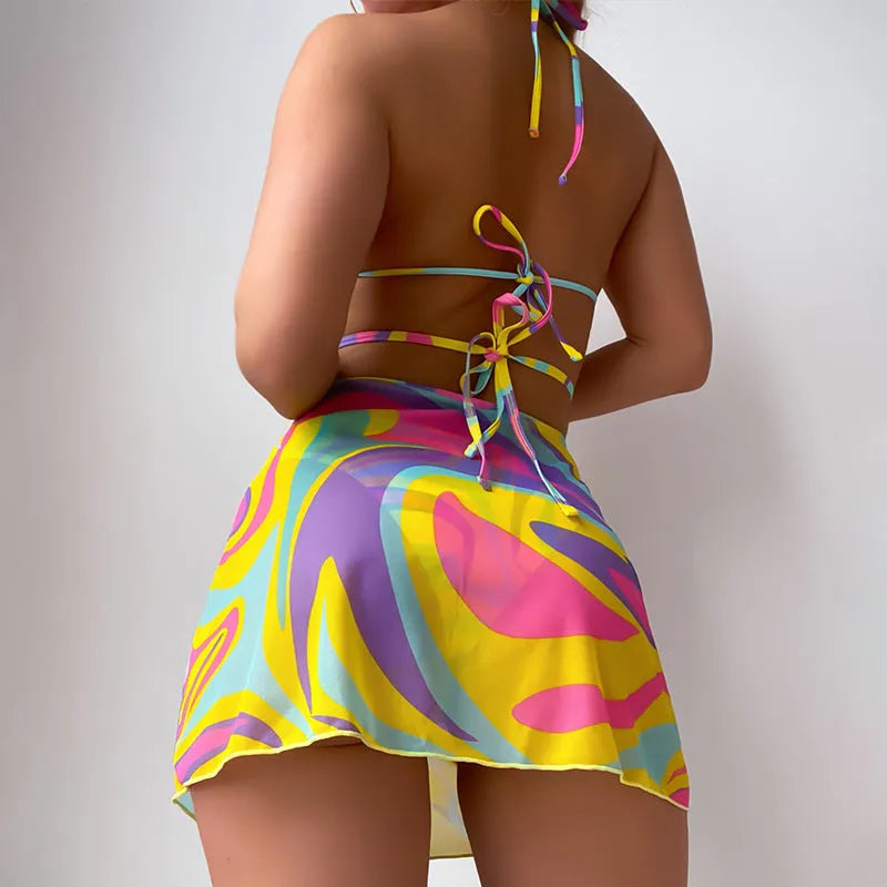 Yellow striped halter lace-up swimsuit set for women, showing top, skirt, and shorts.