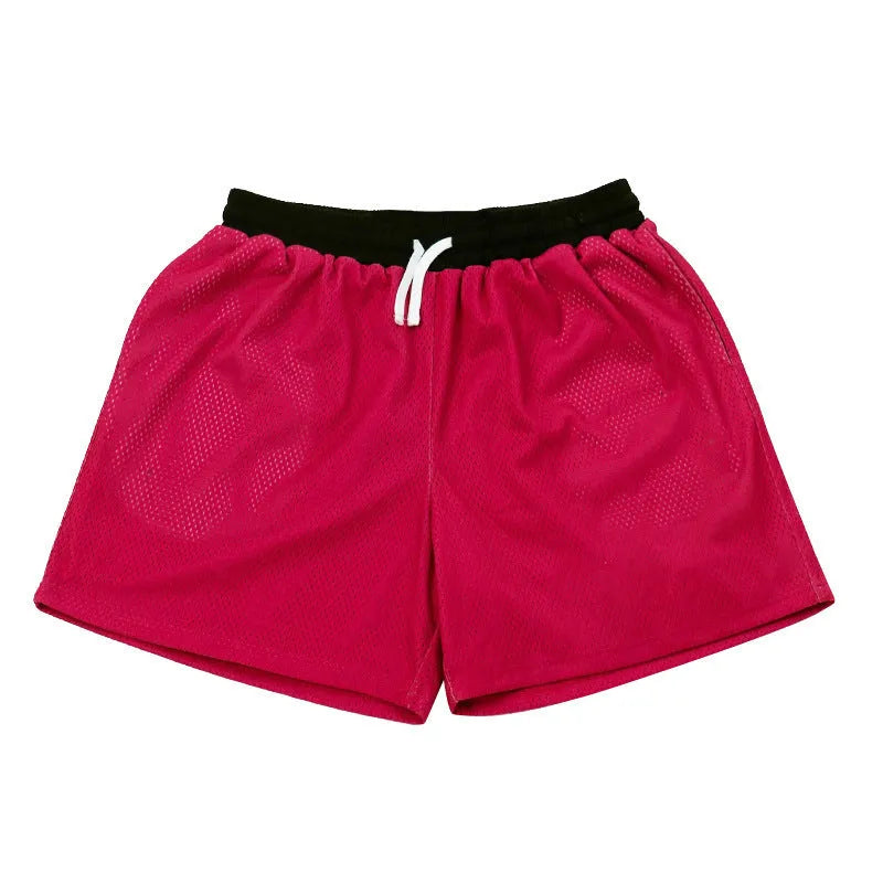 Men's mesh quick-drying shorts in solid colours for running and fitness.