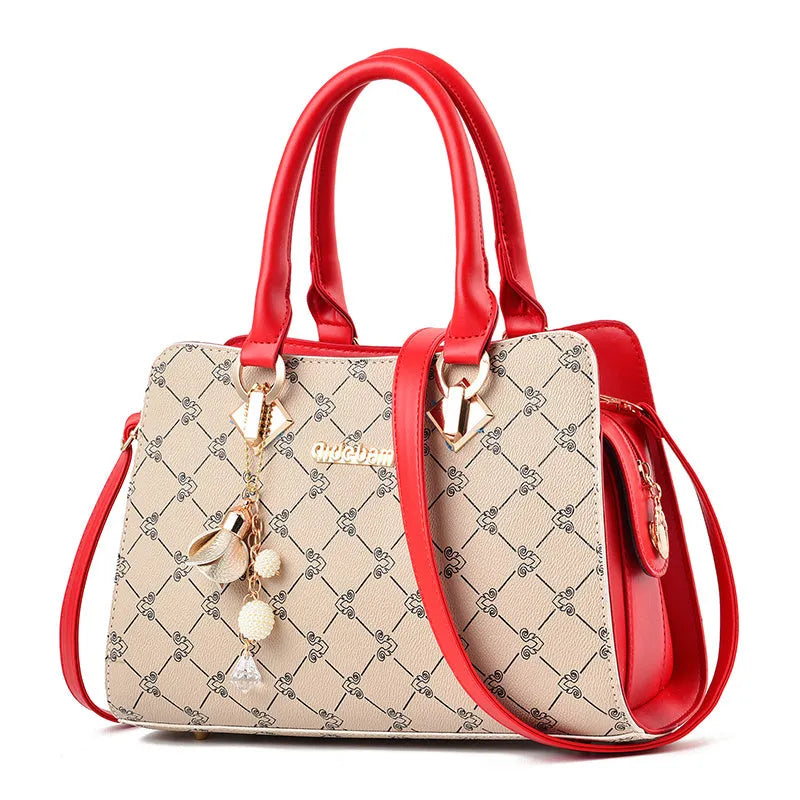 Women's geometric print messenger bag in PU material with internal organisation pockets and zipper closure