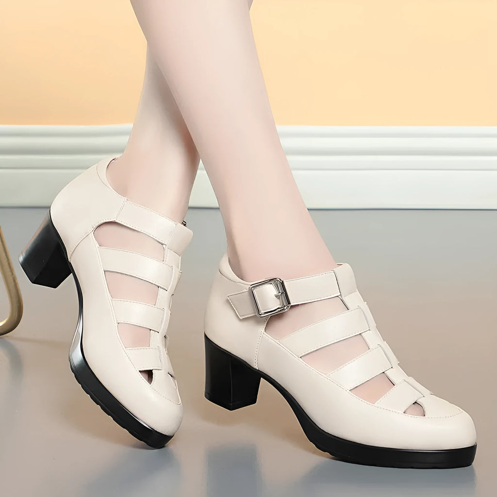 Women's beige closed toe sandals with chunky heel, woven pattern, buckle ankle strap, and back zipper.