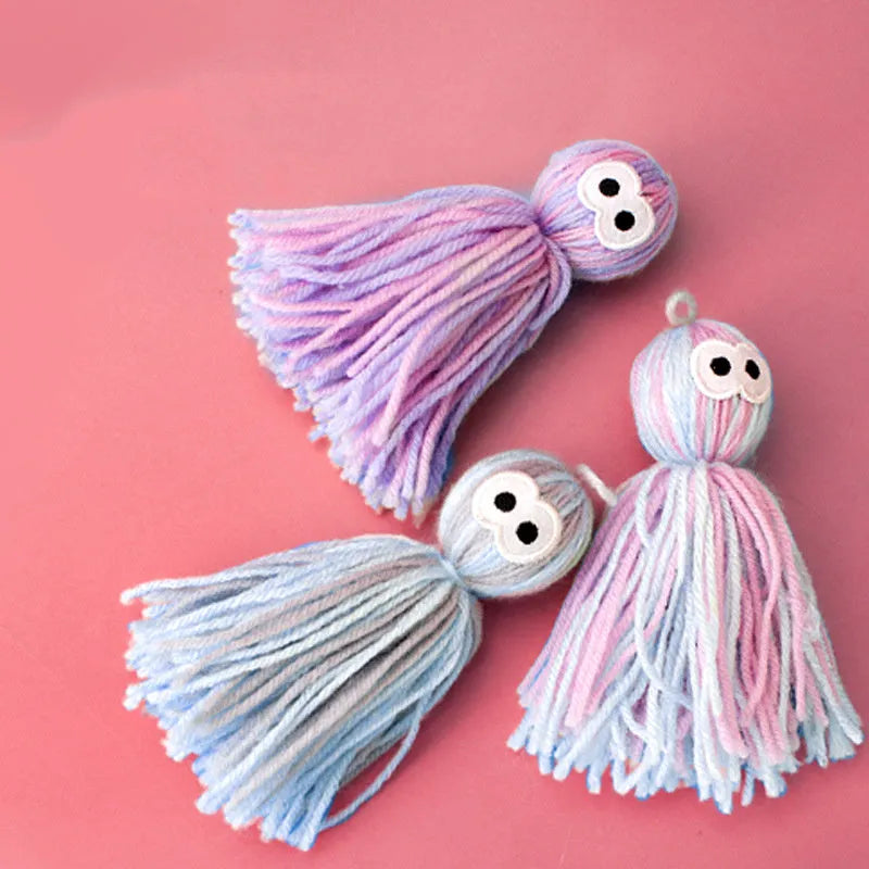 Wool cat toy ball with hanging loop in blue grey colour, dimensions 10x13x4cm