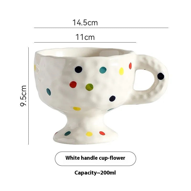 Hand-pinched irregular shaped ceramic mug in solid colour with modern simplicity design