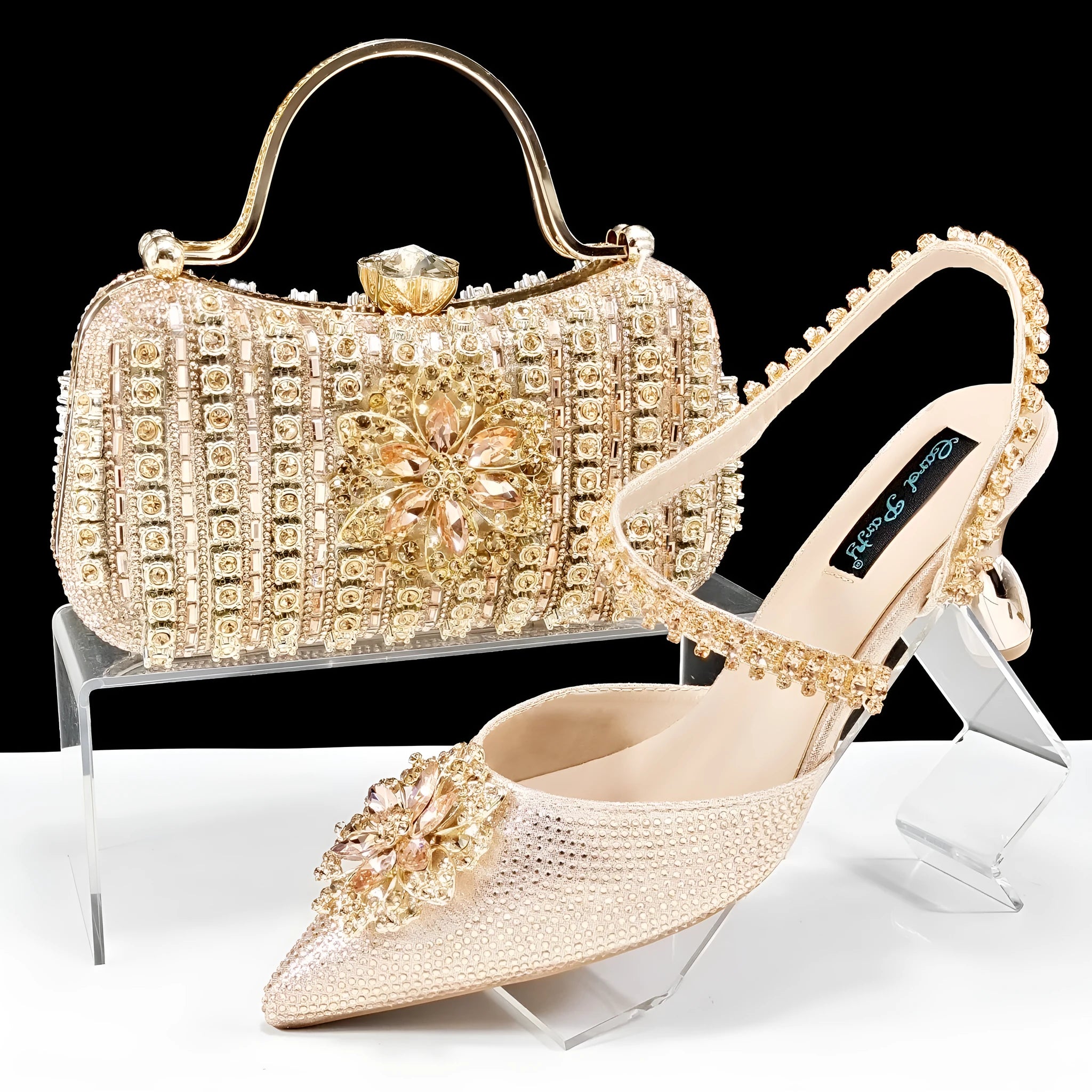Women's high heel shoes with matching clutch bag featuring decorative flower buckle and ankle chain detail