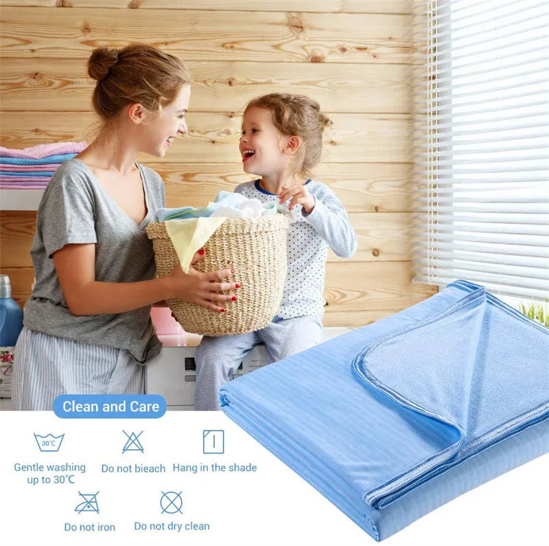 Blue and grey cooling blanket with Japanese Q-Max fibres on a bed.