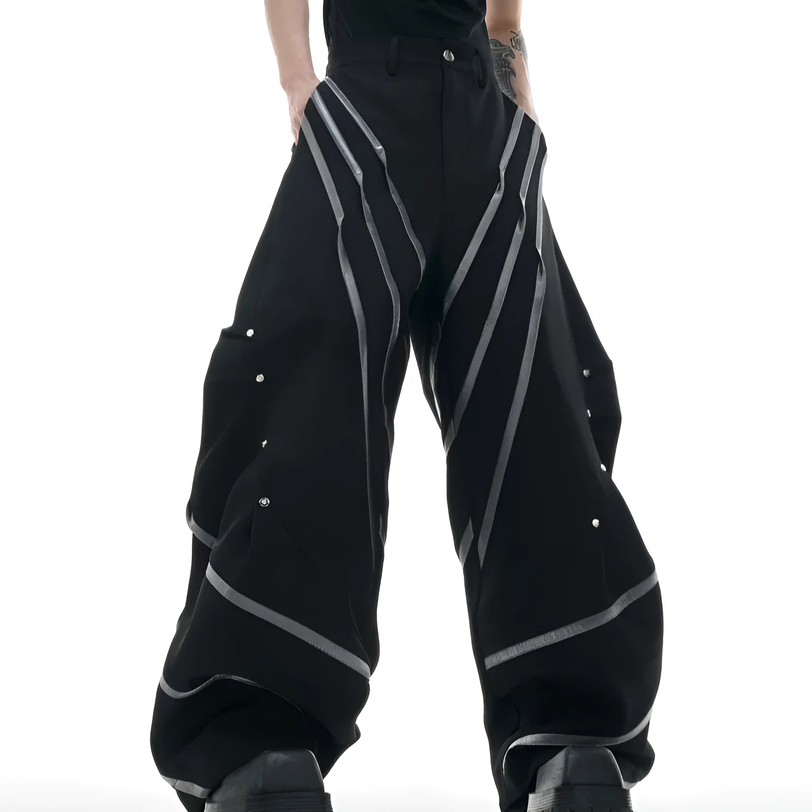 Men's trousers with metal striped rivet pleated design showing three-dimensional cutting detail