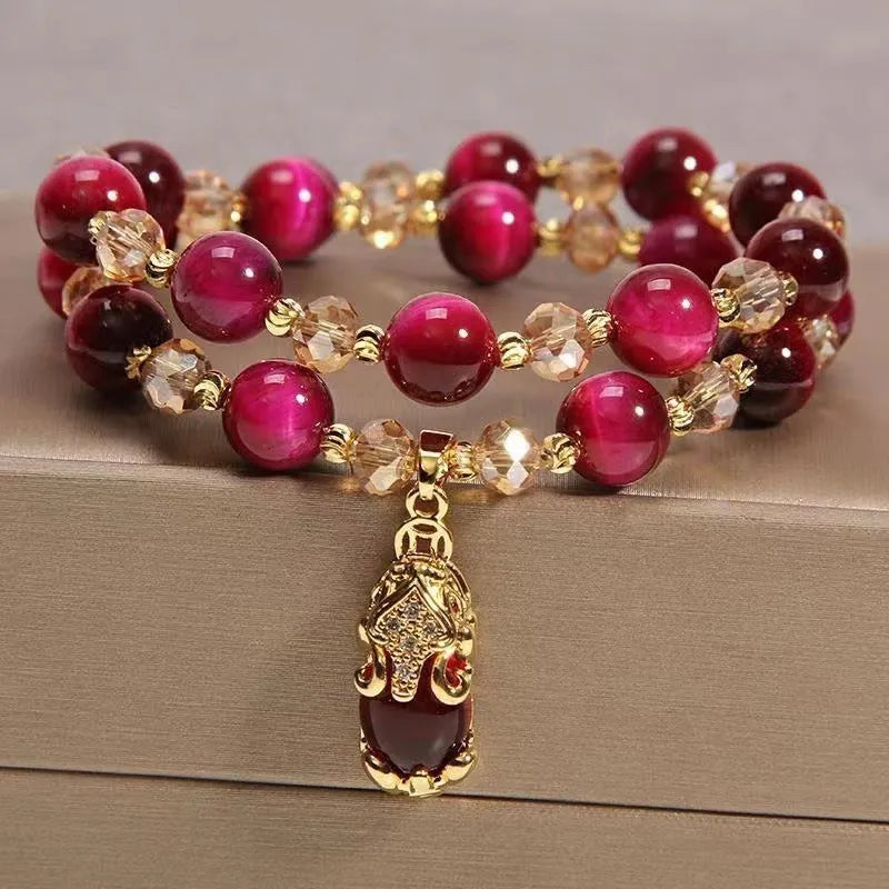 Handmade natural Tigereye stone bracelet with Vanves stone centre, shown in single and double chain designs.