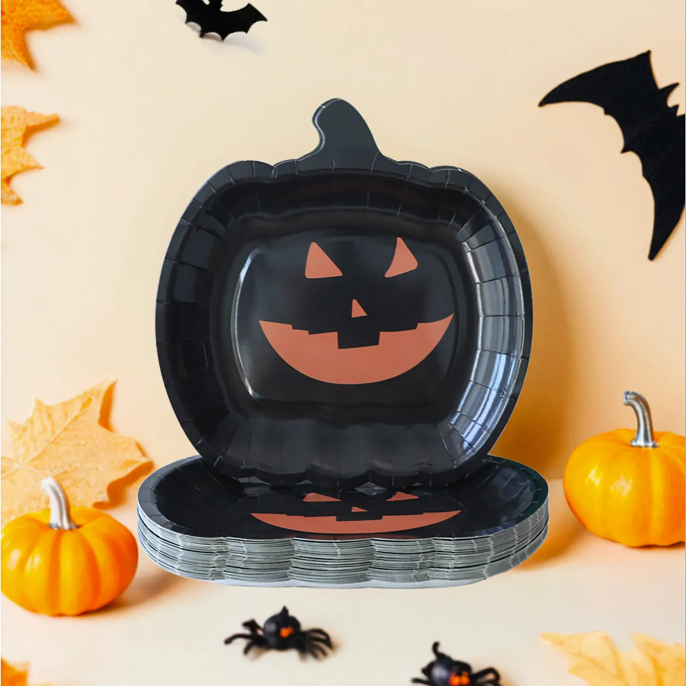 Black Halloween pumpkin design disposable paper plates in 9-inch size for parties
