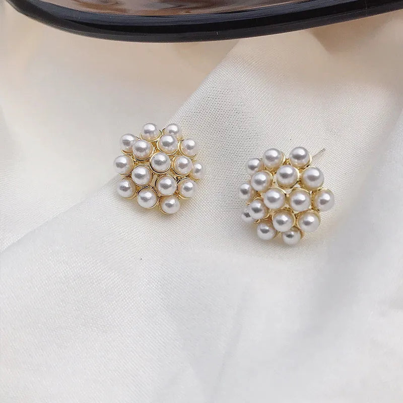 Korean-style alloy fruit earrings with inlaid stones in gold, pearl flower, silver, or starfish pearl finishes.