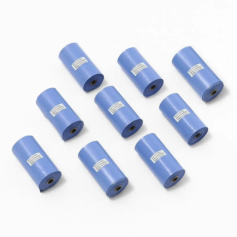 Rolls of green, black, blue, purple and orange degradable pet poo bags with a portable dispenser
