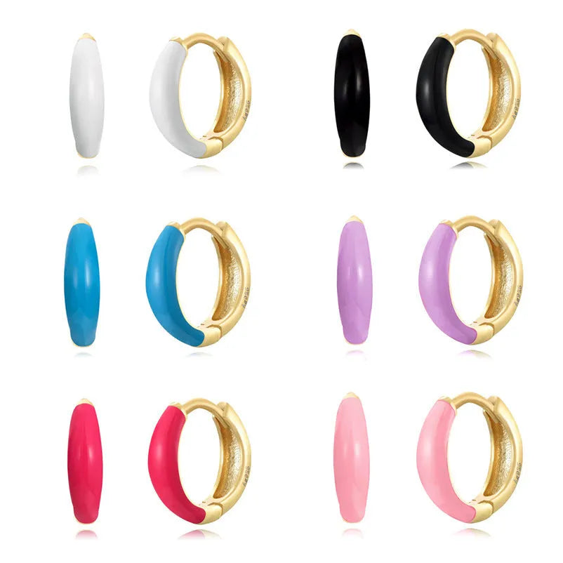 Oval curved women's earrings with colourful epoxy drip coating in geometric U-shape design.