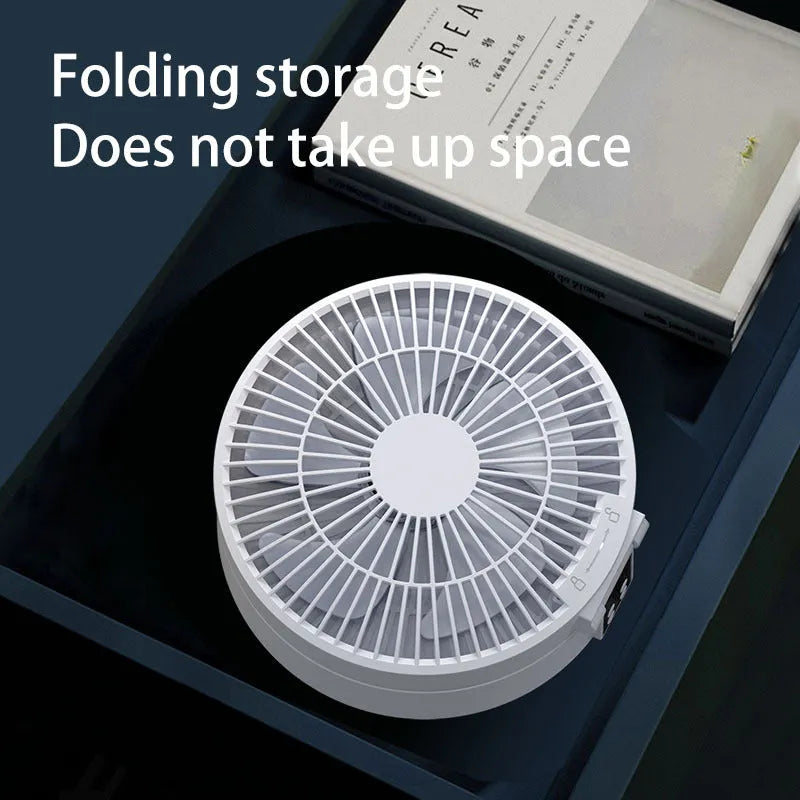 White portable electric fan with remote control showing folded design and night light function