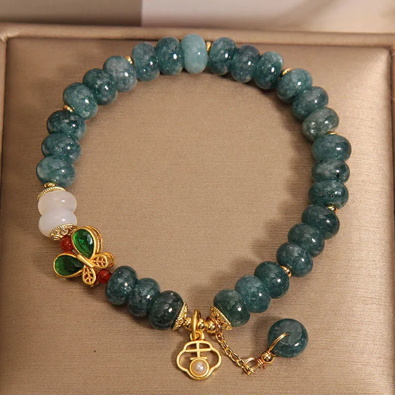Blue water jade abacus beads crystal bracelet with white agate and rhinestone accents on alloy