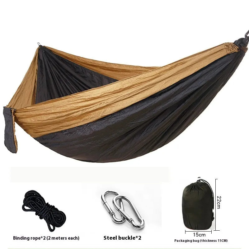 Double camping hammock with ropes and buckles shown in outdoor setting