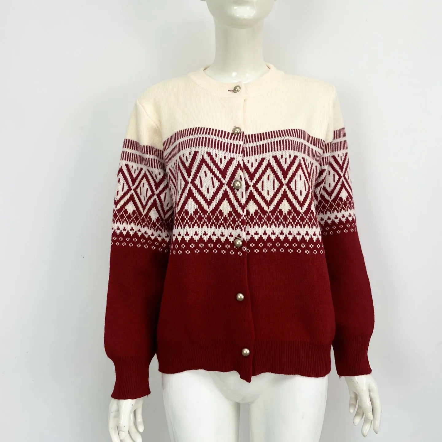 Women's red alpaca wool cardigan with diamond knit pattern and contrast colour long sleeves.