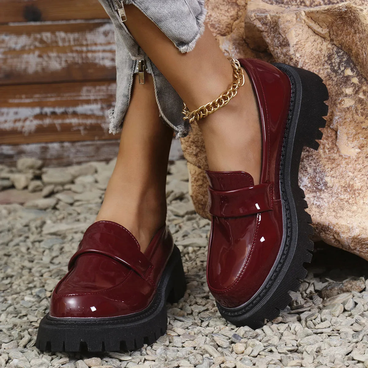 Plus size women's black slip-on loafers with a chunky mid-heel and thick rubber sole.