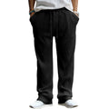 Man wearing casual loose-fit high-waist straight-leg striped trousers in a solid colour.