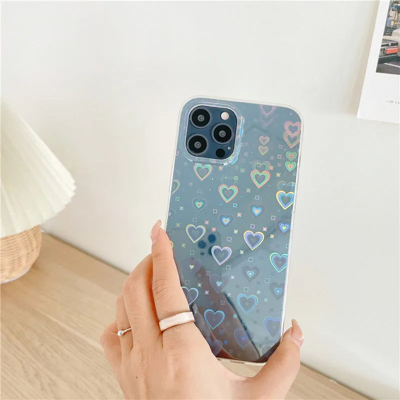 Transparent silicone iPhone case with laser-etched Love design on the back.