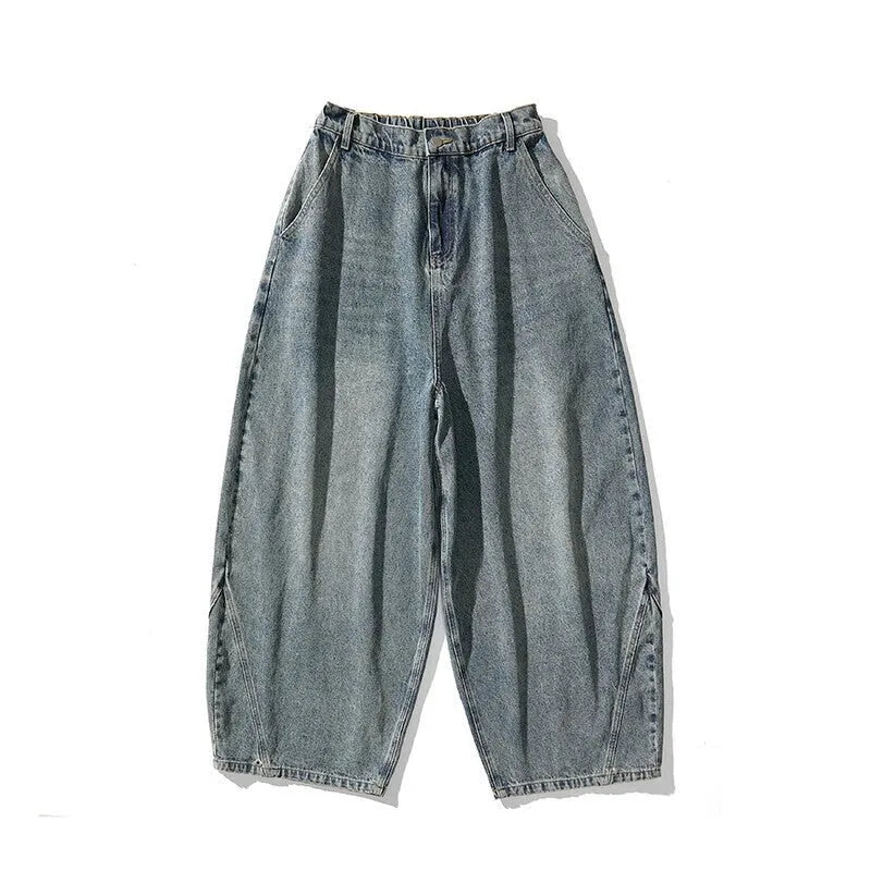Men's plus size baggy wide leg jeans in light blue denim laid flat