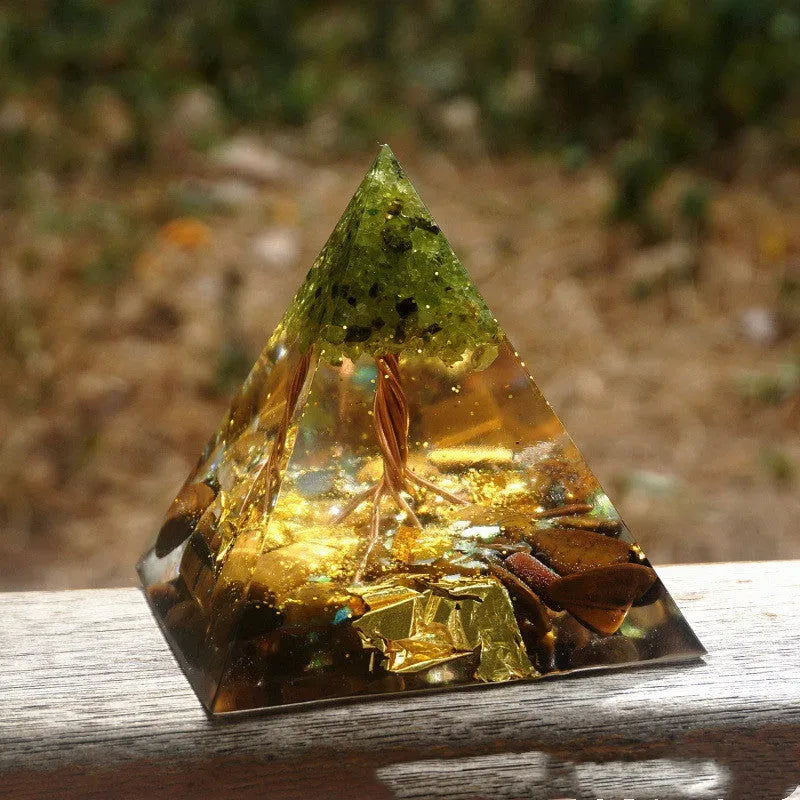 Clear epoxy resin pyramid ornament with embedded coloured crystal gravel inside, measuring 6cm.