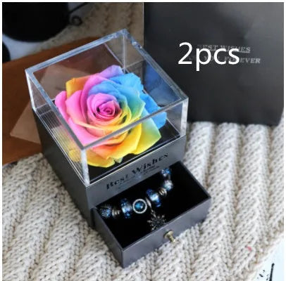 Eternal Flower gift box with preserved roses and carnations inside, measuring 8.5 cm square by 10.5 cm high