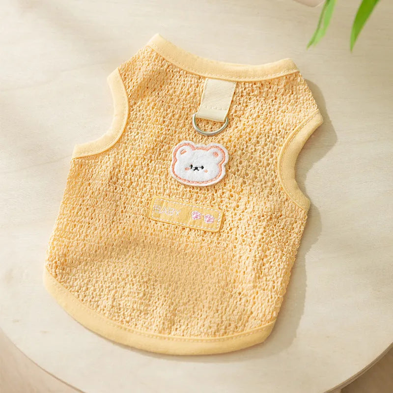 Green bear patch cat clothing with hollowed-out knitted fabric design on a feline
