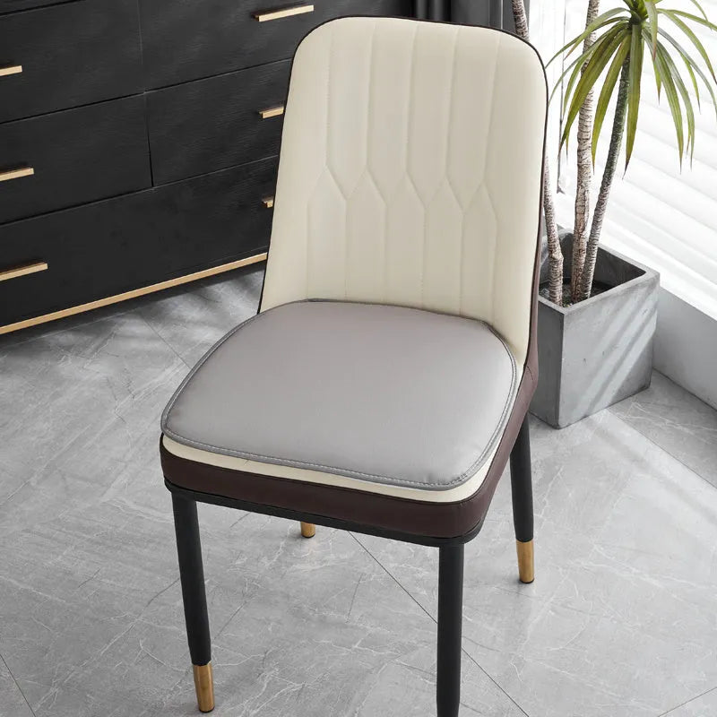 Leather horseshoe-shaped seat cushion in beige colour showing thickness and non-slip design
