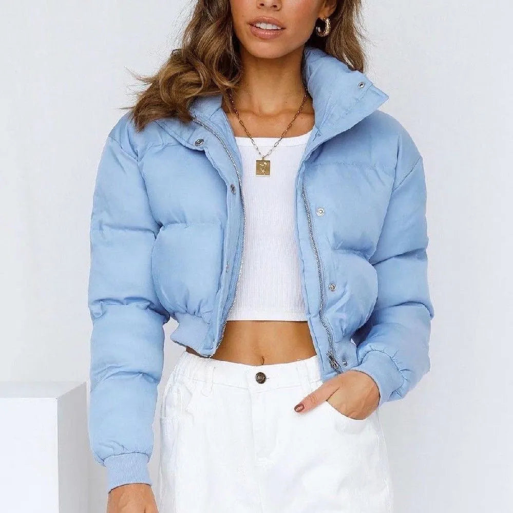 Women's loose fit blue polyester jacket with long sleeves on hanger