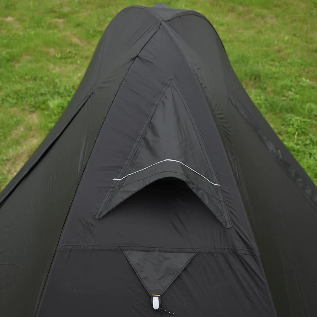 Black single person double account tent with aluminium poles set up outdoors