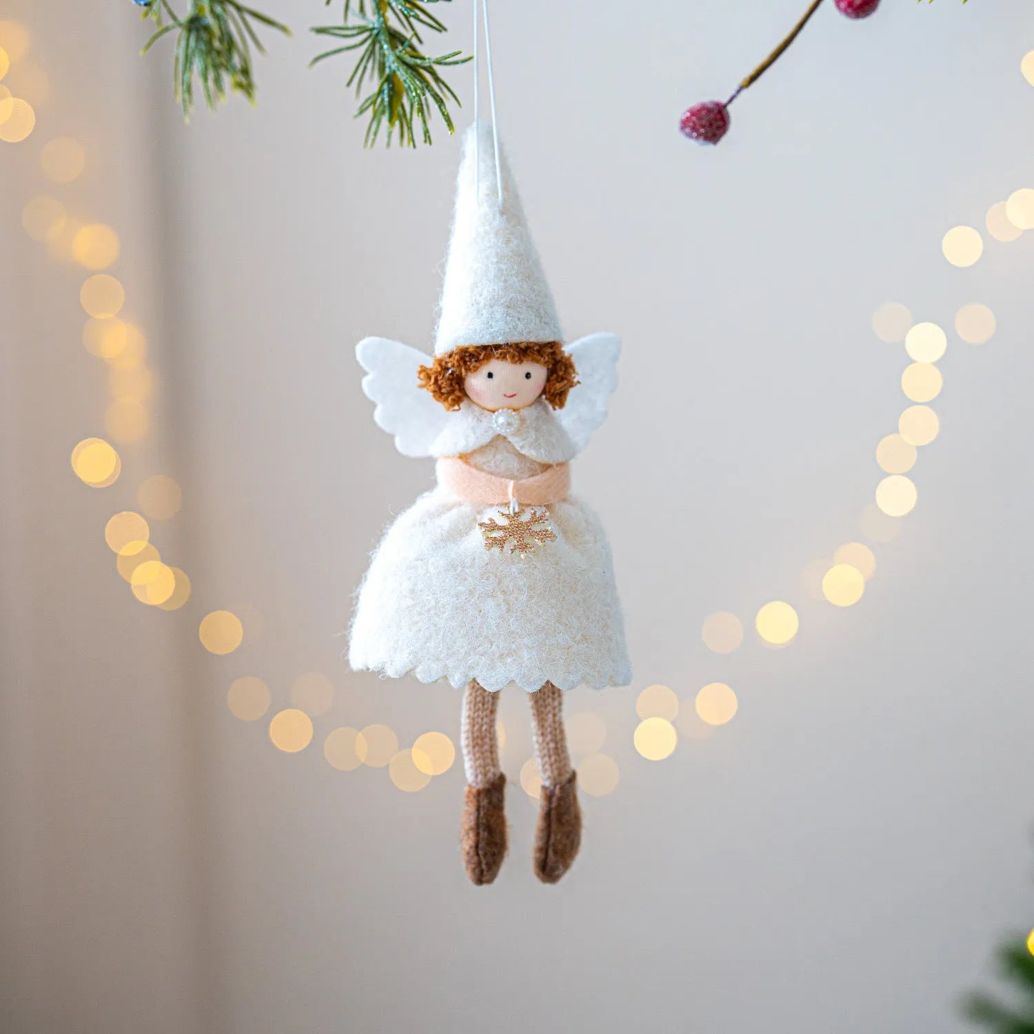 White cloth angel skirt Christmas pendant with plush texture on green tree branch