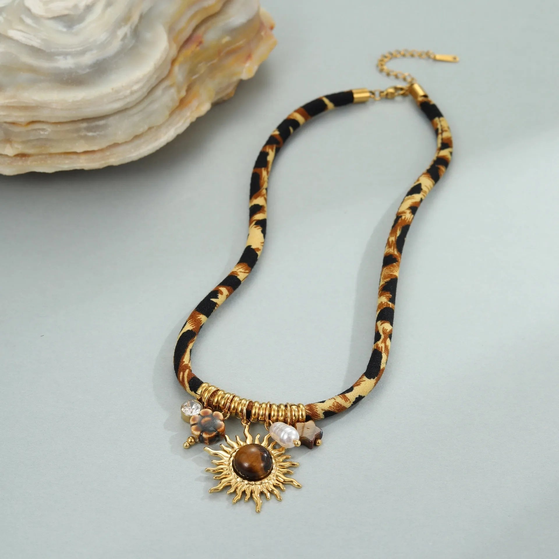 Women's geometric leopard design necklace in stainless steel with gold plating and adjustable chain