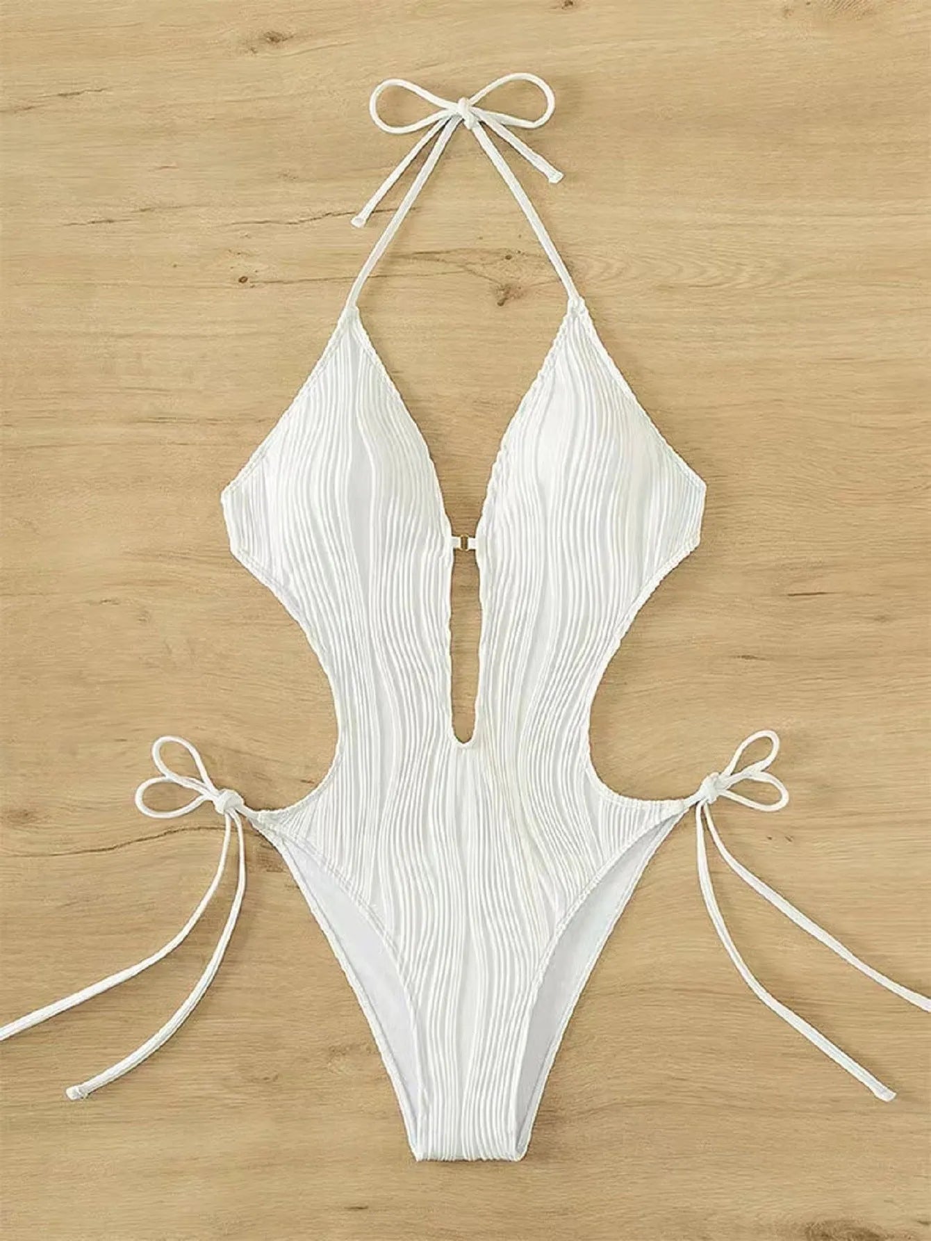 Women's black triangle bikini with front lace-up detail and matching bottoms