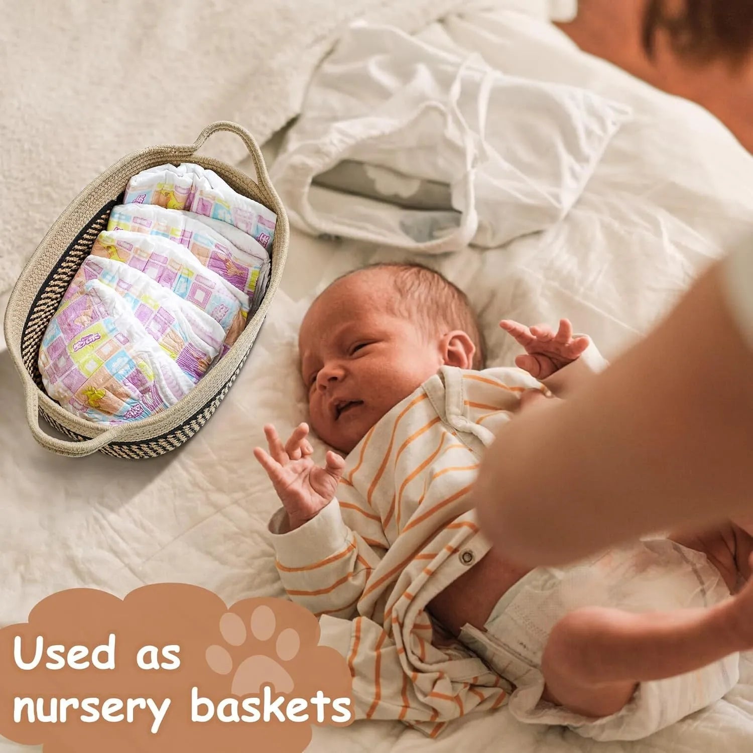 Light beige handmade woven cotton rope storage basket with handle on a wooden surface.
