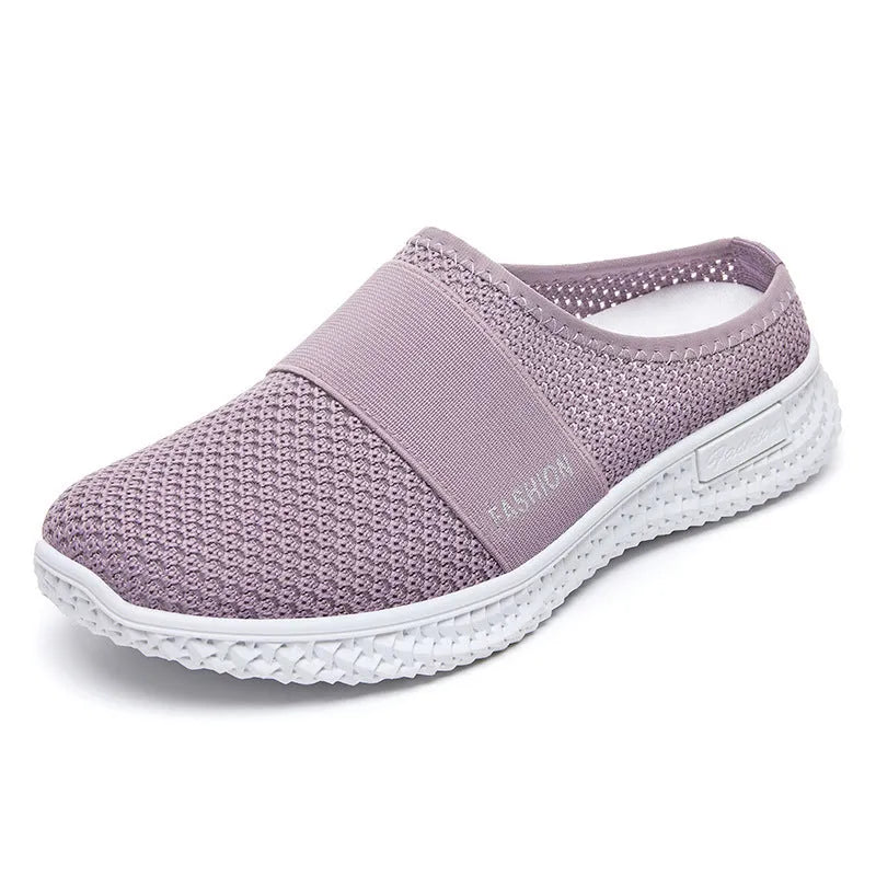 Women's casual breathable mesh shoes with hollow-out design and flat heel in black, gray, pink, or purple.
