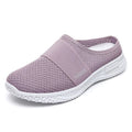 Women's casual breathable mesh shoes with hollow-out design and flat heel in black, gray, pink, or purple.